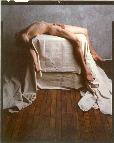 Mark Brickell naked on table, 1984